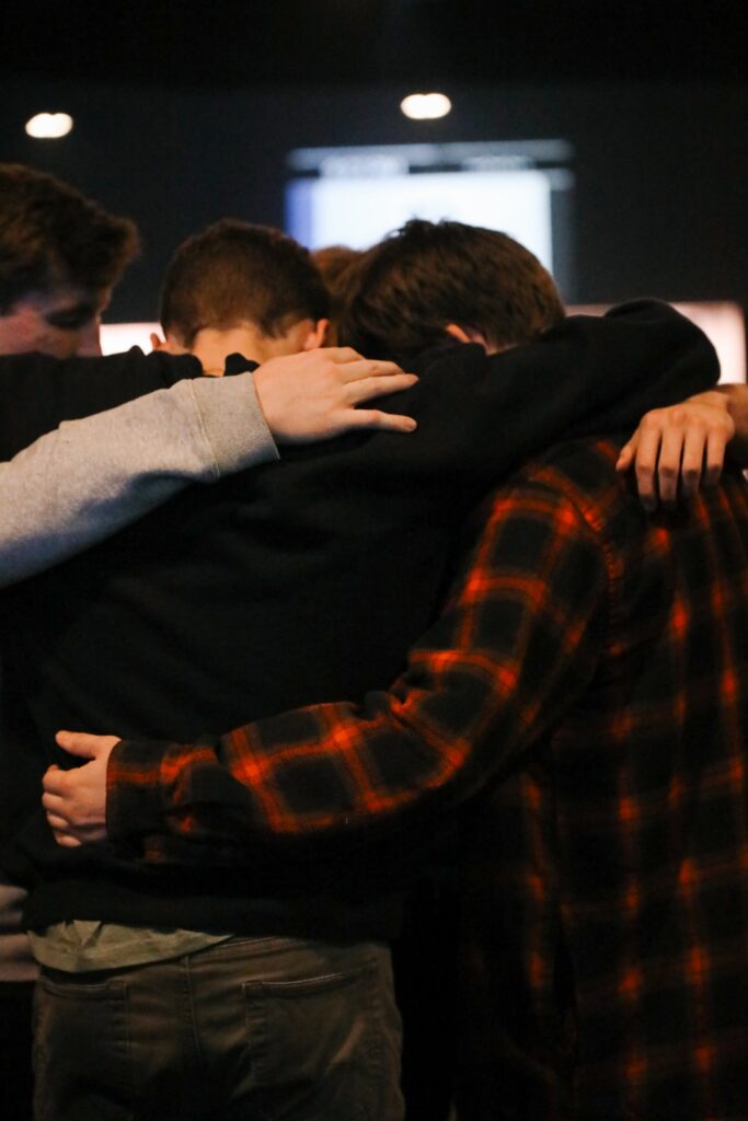 City Church Tallahassee - Group of Boys Hugging Supporting Eachother